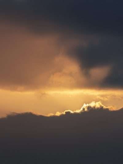 Zonsondergang achter de wolken II